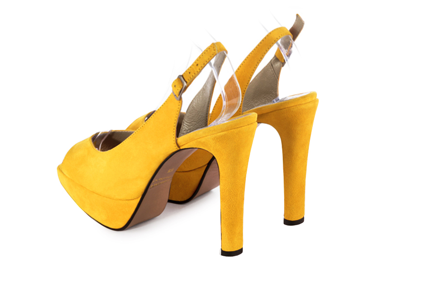 Yellow women's slingback sandals. Round toe. Very high slim heel with a platform at the front. Rear view - Florence KOOIJMAN